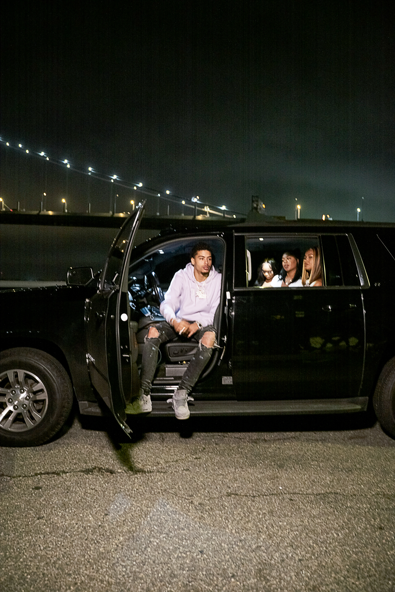 Man sitting in the front seat of an open SUV